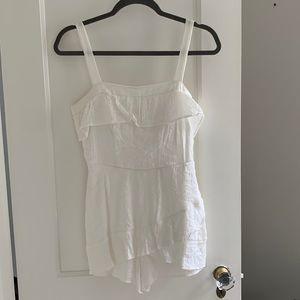 Adorable white romper with tie back